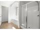Clean bathroom with shower, tub, and toilet at 261 Highland Village Ln, Woodstock, GA 30188