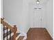 Foyer with hardwood floors and a staircase to the upper level of home at 261 Highland Village Ln, Woodstock, GA 30188
