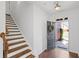 Inviting foyer with hardwood floors, staircase, and view of front door at 261 Highland Village Ln, Woodstock, GA 30188