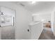 Bright hallway showcasing neutral walls and carpeted floors leading to a bedroom with ample natural light at 261 Highland Village Ln, Woodstock, GA 30188