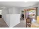 Carpeted hallway leading to a balcony and laundry room for added convenience at 261 Highland Village Ln, Woodstock, GA 30188