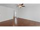 Living room with hardwood floors, ceiling fan, and ample natural light at 261 Highland Village Ln, Woodstock, GA 30188