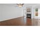Bright living room features a cozy fireplace, hardwood floors, and natural light at 261 Highland Village Ln, Woodstock, GA 30188