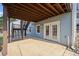 Covered back patio leading to a backyard with a second story deck and stairway at 5265 Bentley Hall Dr, Alpharetta, GA 30005