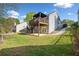 Spacious back yard with patio and deck access on the exterior of the home at 5265 Bentley Hall Dr, Alpharetta, GA 30005