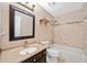 Bathroom with a vanity, a sink, and a combined tub and shower with tile surround at 5265 Bentley Hall Dr, Alpharetta, GA 30005