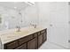 Bathroom with double sink vanity, large mirror, and modern fixtures at 5265 Bentley Hall Dr, Alpharetta, GA 30005