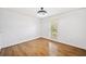 Bedroom featuring hardwood floors, natural light, and neutral paint at 5265 Bentley Hall Dr, Alpharetta, GA 30005