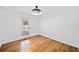 Bedroom featuring hardwood floors, neutral paint, and a modern ceiling fan at 5265 Bentley Hall Dr, Alpharetta, GA 30005
