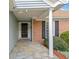 Welcoming front porch featuring a stone pathway, brick accents, and a classic column, creating an inviting entrance at 5265 Bentley Hall Dr, Alpharetta, GA 30005