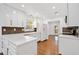 Modern kitchen featuring white cabinets, sleek countertops, stainless steel appliances, and hardwood floors at 5265 Bentley Hall Dr, Alpharetta, GA 30005