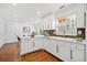 Well-lit kitchen featuring white cabinetry, stainless steel appliances, and an eat-in space at 5265 Bentley Hall Dr, Alpharetta, GA 30005
