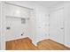 Functional laundry room with storage cabinets and convenient access to other areas of the home at 5265 Bentley Hall Dr, Alpharetta, GA 30005