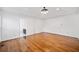 Spacious living room featuring hardwood floors, recessed lighting, and neutral paint at 5265 Bentley Hall Dr, Alpharetta, GA 30005