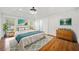 Inviting main bedroom with hardwood floors, stylish decor, and ample natural light at 5265 Bentley Hall Dr, Alpharetta, GA 30005