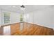 Spacious main bedroom with laminate wood floors, ample natural light, and a ceiling fan at 5265 Bentley Hall Dr, Alpharetta, GA 30005