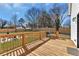 Wooden deck with fenced in backyard, grill and chairs at 1774 Vesta Ave, Atlanta, GA 30337