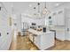 Stylish kitchen featuring a white island, stainless steel appliances, and modern pendant lighting at 1774 Vesta Ave, Atlanta, GA 30337
