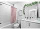 Bright bathroom with white subway tile, modern vanity, and decorative accents at 2614 Talley St, Decatur, GA 30030