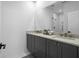 Modern bathroom with double vanity, granite countertops, and a glass-enclosed shower at 2614 Talley St, Decatur, GA 30030