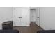 Bedroom with hardwood floors, ample closet space, and a minimalist aesthetic at 2614 Talley St, Decatur, GA 30030