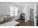 Bright bedroom featuring wood floors, a window, a work desk, and an ensuite bathroom at 2614 Talley St, Decatur, GA 30030