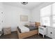 Inviting bedroom with warm wood accents, stylish decor, and natural light from the window at 2614 Talley St, Decatur, GA 30030