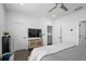 Modern bedroom with a ceiling fan, light gray bedding and hardwood floors at 2614 Talley St, Decatur, GA 30030