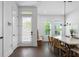 Bright dining room with modern light fixture, wood floors, and natural light at 2614 Talley St, Decatur, GA 30030