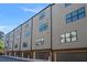 Exterior view of modern townhomes with garage doors at 2614 Talley St, Decatur, GA 30030