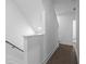 Hallway with hardwood flooring and white walls and stairs at 2614 Talley St, Decatur, GA 30030