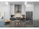 Modern kitchen with gray island, stainless steel appliances, and white cabinets at 2614 Talley St, Decatur, GA 30030