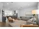 Open living space with modern decor, connecting to a kitchen with a large island at 2614 Talley St, Decatur, GA 30030