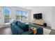 Bright living room with hardwood floors, large windows, and comfortable seating at 2614 Talley St, Decatur, GA 30030