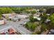 Aerial view showcasing the town square, featuring a gazebo, local businesses, and surrounding trees at 262 E Main St, Rutledge, GA 30663
