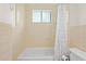 Bathroom with white tile and neutral fixtures at 262 E Main St, Rutledge, GA 30663