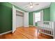 Bedroom with open closet and hardwood floors at 262 E Main St, Rutledge, GA 30663