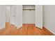Bedroom with hardwood floors and closet at 262 E Main St, Rutledge, GA 30663