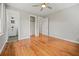Bright bedroom with hardwood floors, ceiling fan, and attached bathroom at 262 E Main St, Rutledge, GA 30663