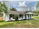 Charming home with front porch and landscaped yard at 262 E Main St, Rutledge, GA 30663
