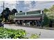 Charming building featuring a covered awning and street-side appeal, enhanced by lush green landscaping at 262 E Main St, Rutledge, GA 30663