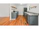 Updated kitchen with stainless steel appliances, hardwood floors, and dark cabinetry at 262 E Main St, Rutledge, GA 30663