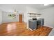 Open-concept kitchen with new appliances, dark cabinets, and floating shelves at 262 E Main St, Rutledge, GA 30663