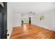 Bright living room featuring hardwood floors, a ceiling fan, and neutral paint at 262 E Main St, Rutledge, GA 30663