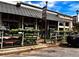 Local Rutledge Hardware storefront with plants and flowers on display, showcasing its welcoming facade at 262 E Main St, Rutledge, GA 30663