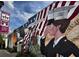 Detailed mural featuring American flags, an eagle, and saluting military personnel, honoring local history at 262 E Main St, Rutledge, GA 30663