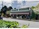 Charming storefront with a green facade, awning, and outdoor seating, creating an inviting atmosphere at 262 E Main St, Rutledge, GA 30663