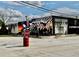 A patriotic mural adorns a building on a street corner with stop signs in the foreground at 262 E Main St, Rutledge, GA 30663