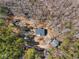 Overhead aerial of home on a private, wooded lot with mature trees and outbuildings at 4941 N Helton Rd, Winston, GA 30187