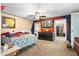 Bedroom featuring a colorful wall, TV, and an adjoining walk-in closet at 4941 N Helton Rd, Winston, GA 30187